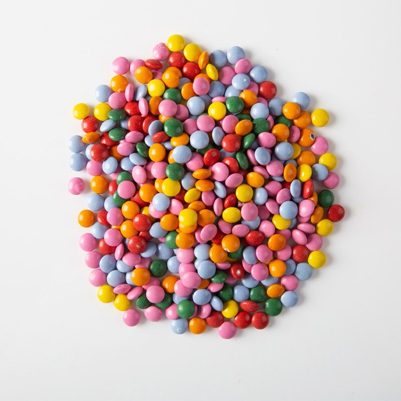 Sachet de mini lentilles chocolat colorées